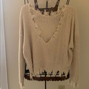 Cream sweater with fringe detail